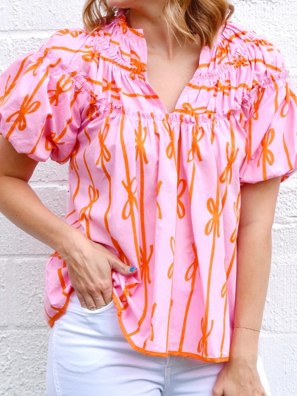 Umgee Pink Top with Orange Bow-Print Puff Sleeves